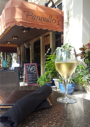 Wine Glass and Menu with Pannullos awning in background